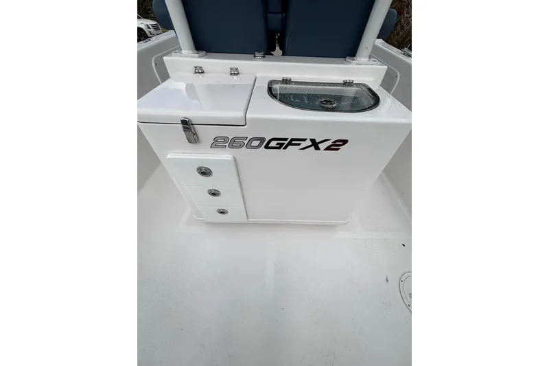 Slide: The Image of 2025 Twin Vee 260 GFX2 CC boat console with storage and seating. - 23
