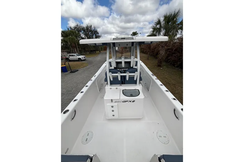 Slide: The Image of 2025 Twin Vee 260 GFX2 CC boat, center console, white interior, outdoor setting. - 25