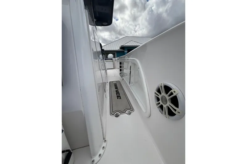 Slide: The Image of 2025 Twin Vee 260 GFX2 CC boat deck with speaker and branded mat. - 29