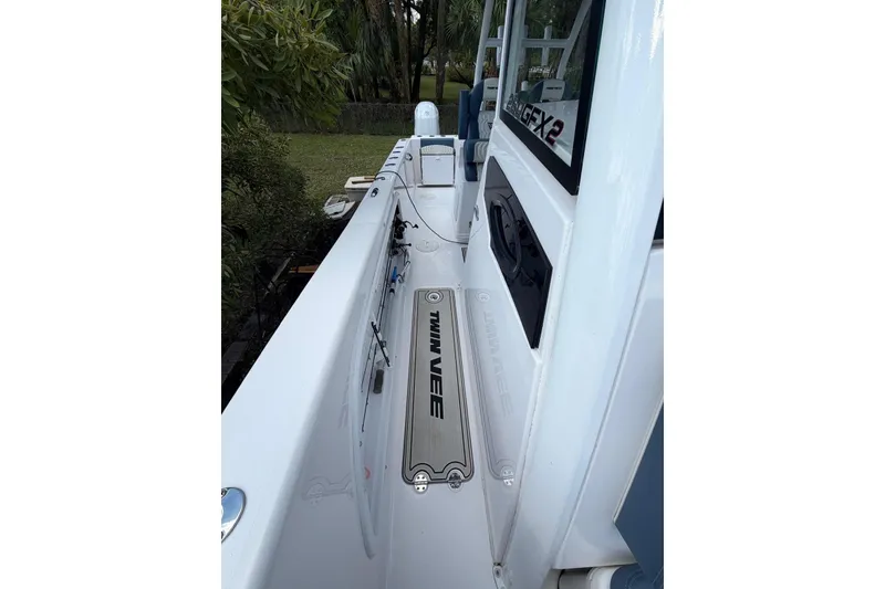 Slide: The Image of 2025 Twin Vee 260 GFX2 CC boat deck, sleek design, and modern features. - 7