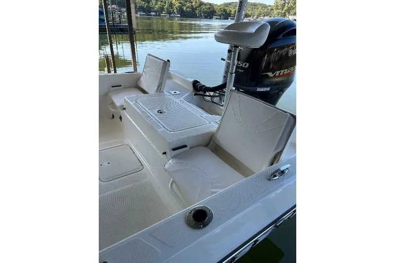 Slide: The Image of 2023 Skeeter SX210 boat interior with seating and Yamaha VMAX engine. - 14