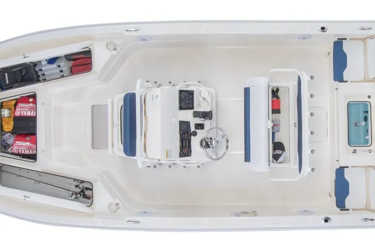 Slide: The Image of 2023 Skeeter SX210 boat interior, top view showing seating and storage compartments. - 16