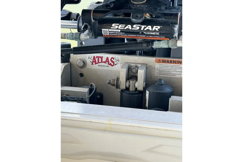 Slide: The Image of 2023 Skeeter SX210 boat with SeaStar hydraulic steering and Atlas jack plate. - 18
