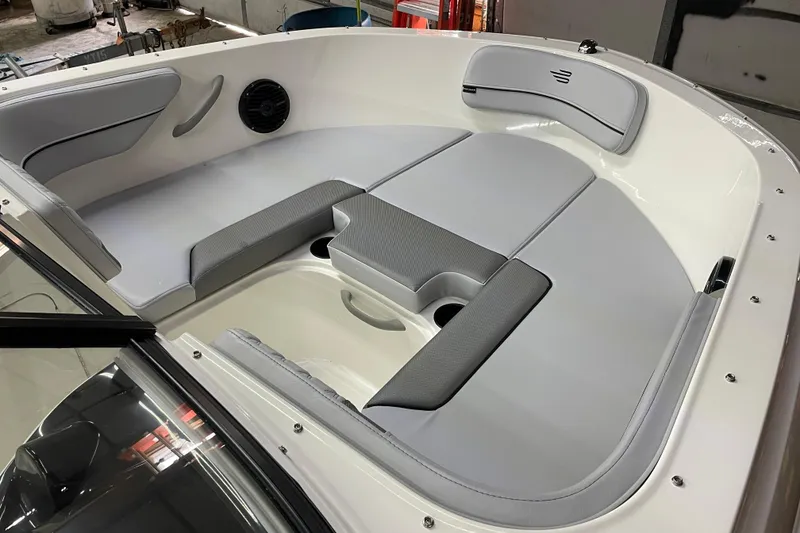 Slide: The Image of 2026 Bayliner VR4 Bowrider OB interior with gray seating and modern design. - 10