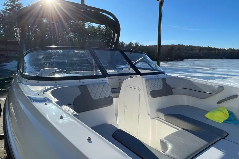 Slide: The Image of 2026 Bayliner VR4 Bowrider OB boat interior with sunlit seating and windshield. - 11