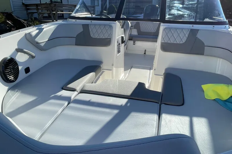 Slide: The Image of 2026 Bayliner VR4 Bowrider OB interior with cushioned seating and modern design. - 15