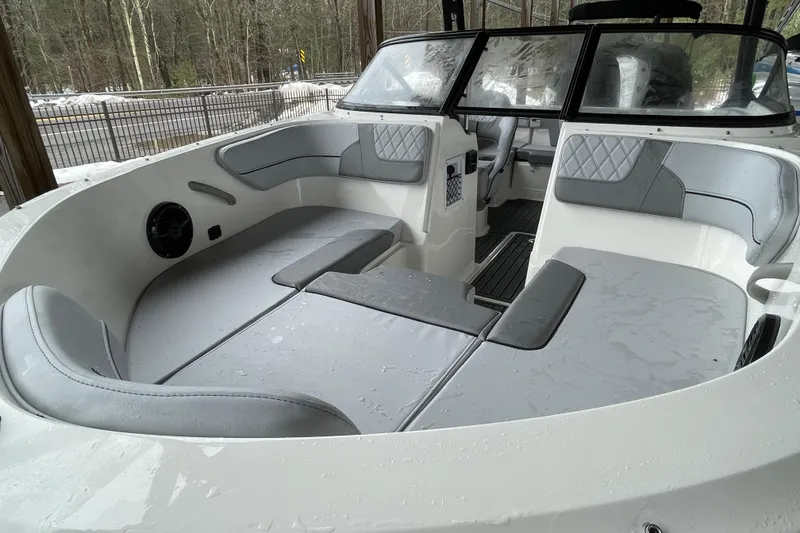 Slide: The Image of 2026 Bayliner VR4 Bowrider OB interior with gray seating and modern design. - 19
