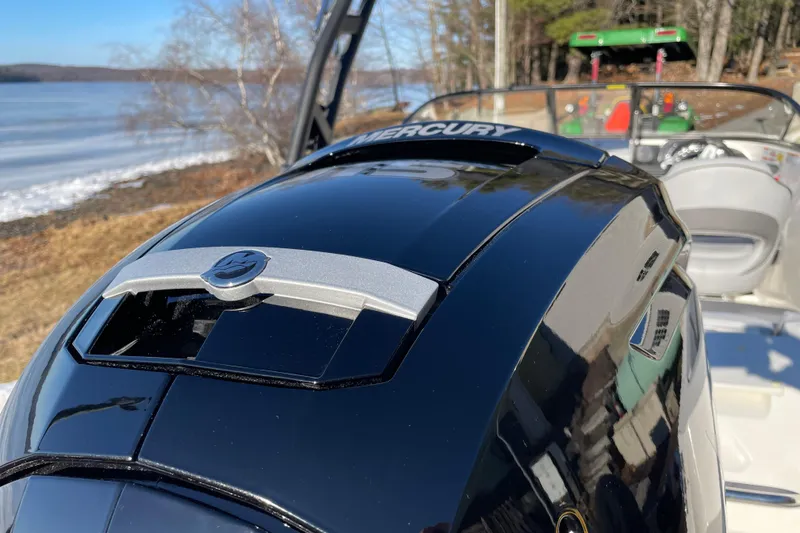 Slide: The Image of 2026 Bayliner VR4 Bowrider OB with Mercury engine by a lake. - 26