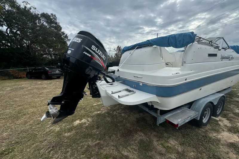Slide: The Image of 2012 Splendor 259 SUNSTAR boat with Suzuki outboard motor on trailer. - 9