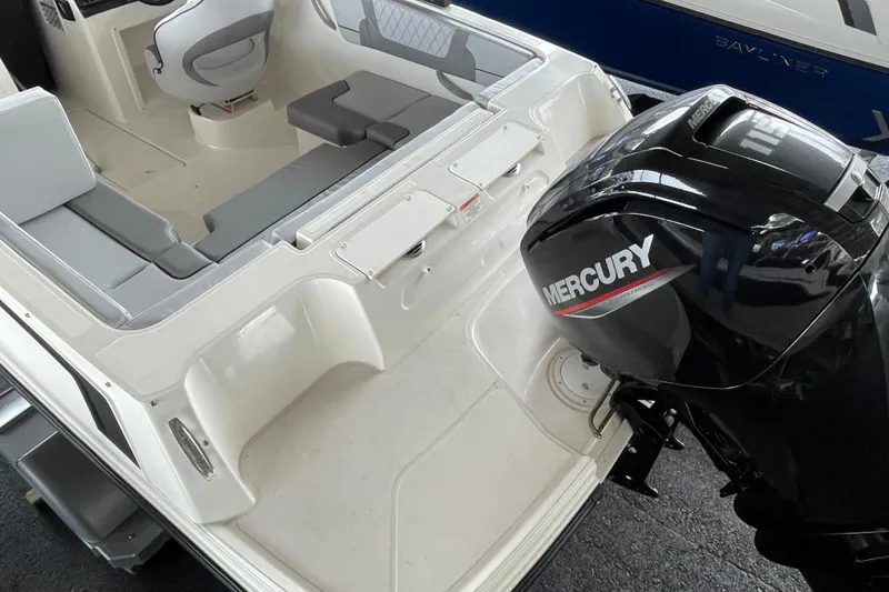 Slide: The Image of 2026 Bayliner VR4 Bowrider OB with Mercury outboard engine, interior seating view. - 8
