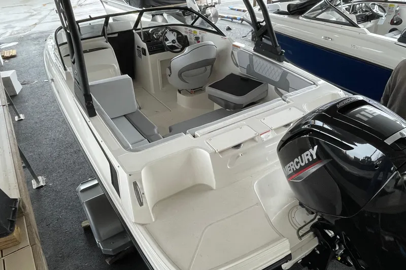 Slide: The Image of 2026 Bayliner VR4 Bowrider OB with Mercury outboard engine, interior view. - 9