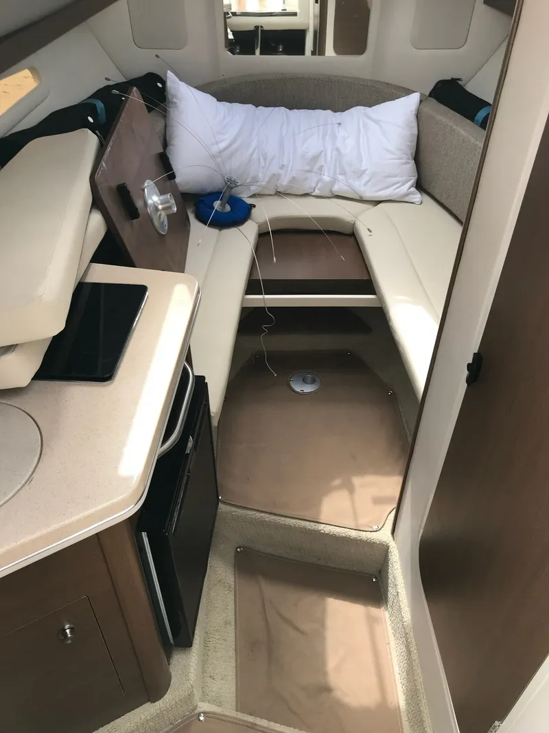 Slide: The Image of Interior of 2016 Sea Ray 260 Sundancer with sleeping area. - 10
