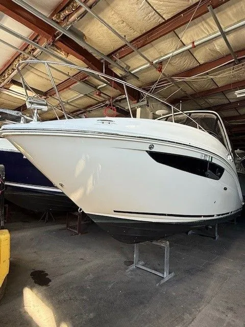 Slide: The Image of 2016 Sea Ray 260 Sundancer boat in storage facility. - 12