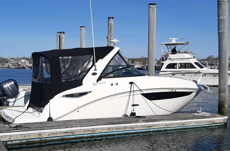 Slide: The Image of 2016 Sea Ray 260 Sundancer at dock, sunny day. - 2