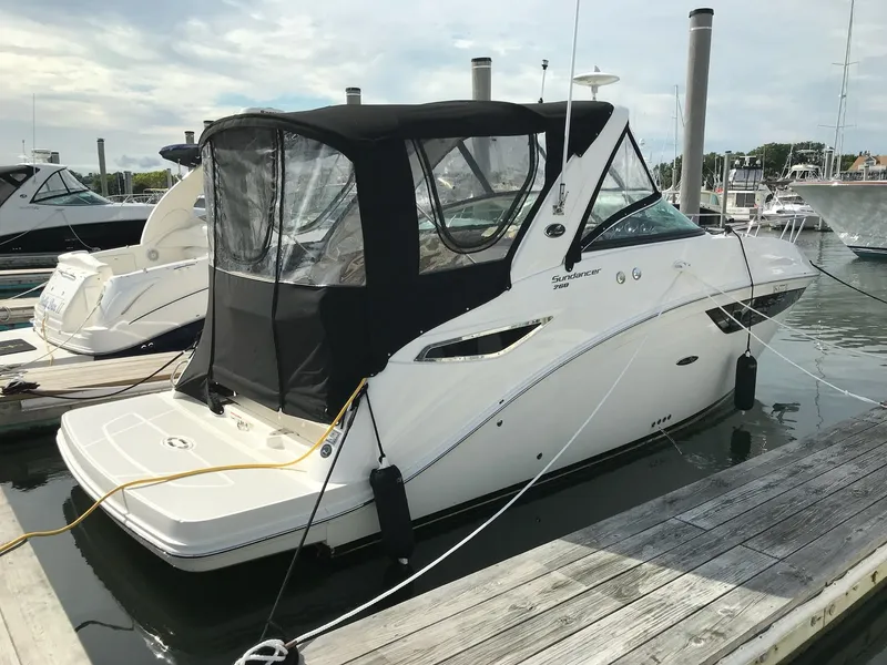 Slide: The Image of 2016 Sea Ray 260 Sundancer docked at marina. - 3