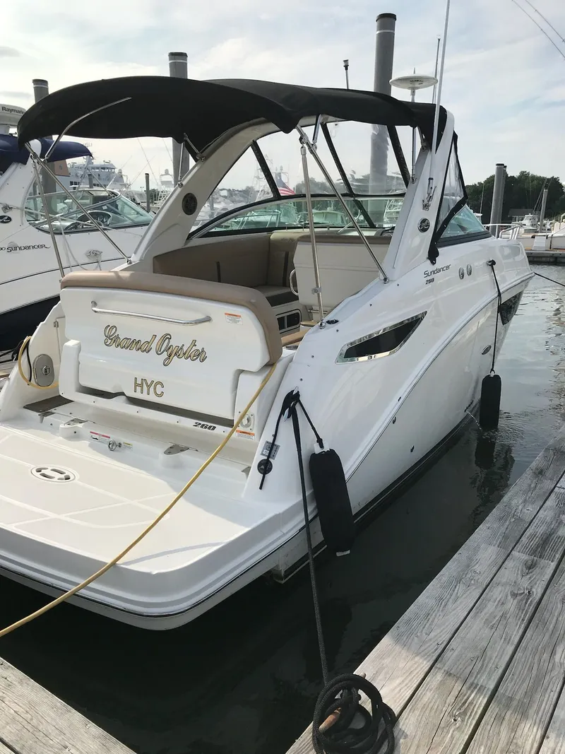 Slide: The Image of 2016 Sea Ray 260 Sundancer boat docked at marina. - 4