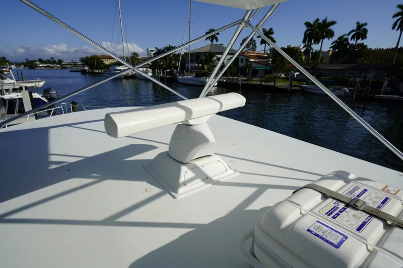 Slide: The Image of Radar equipment on 1998 Viking Open Express 43 boat, docked near palm trees and waterway. - 14