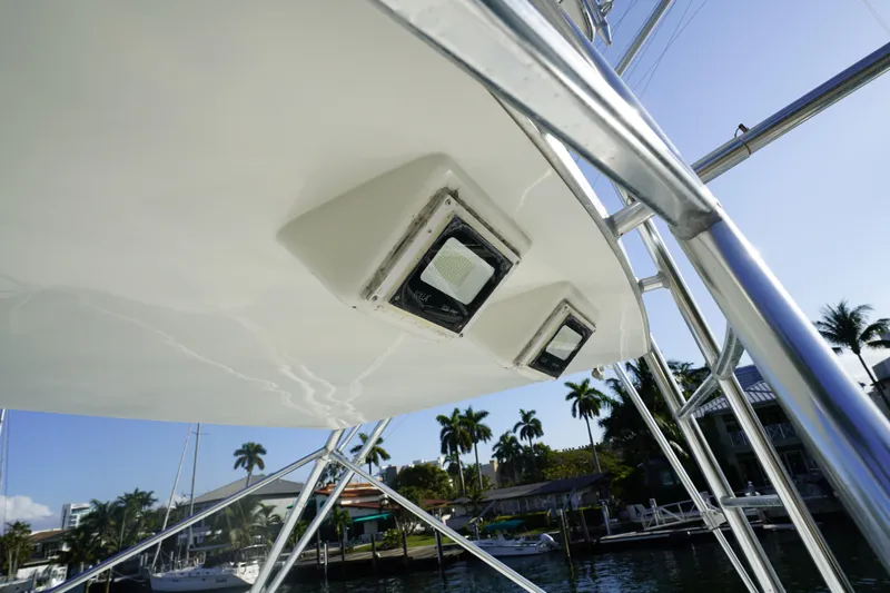 Slide: The Image of Close-up of 1998 Viking Open Express 43 boat's underside with lights and metal framework. - 15