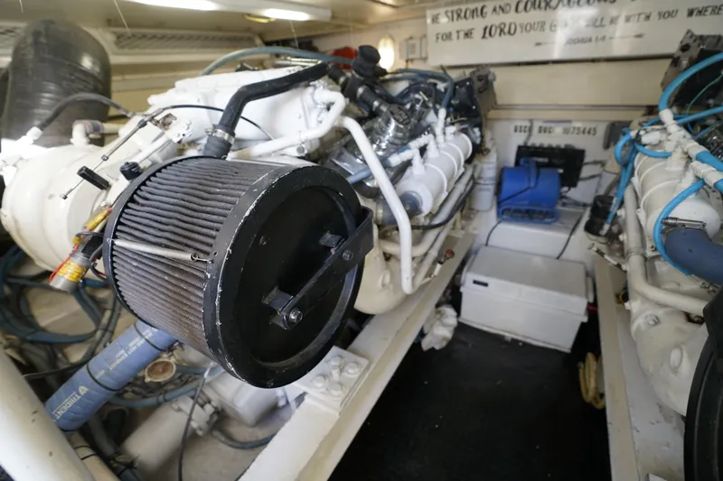 Slide: The Image of Engine room of 1998 Viking Open Express 43 with visible components and wiring. - 19