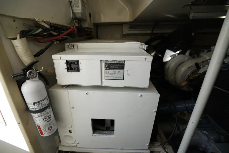 Slide: The Image of Engine room of 1998 Viking Open Express 43 with generator and fire extinguisher. - 20