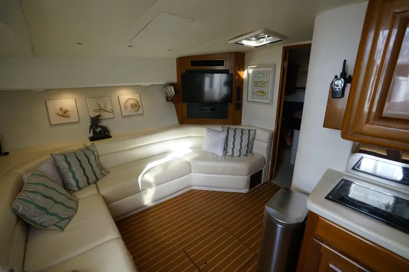 Slide: The Image of Interior of 1998 Viking Open Express 43 yacht with cozy seating and modern decor. - 7