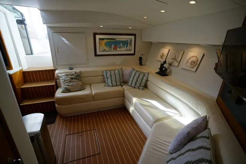 Slide: The Image of Luxurious interior of 1998 Viking Open Express 43 yacht with plush seating and nautical decor. - 9