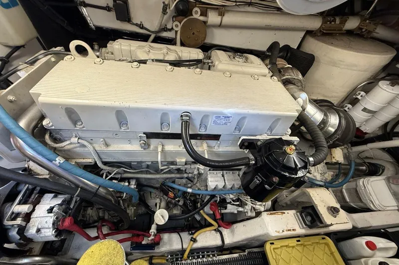 Slide: The Image of Engine compartment of a 2004 Tiara Yachts 4200 Open, showcasing detailed mechanical components. - 14