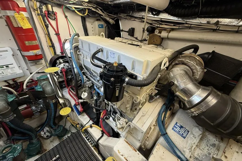 Slide: The Image of Engine room of a 2004 Tiara Yachts 4200 Open, showcasing detailed mechanical components. - 17