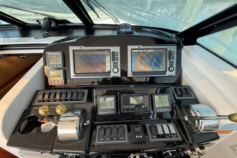 Slide: The Image of Dashboard of a 2004 Tiara Yachts 4200 Open with navigation and control systems. - 20