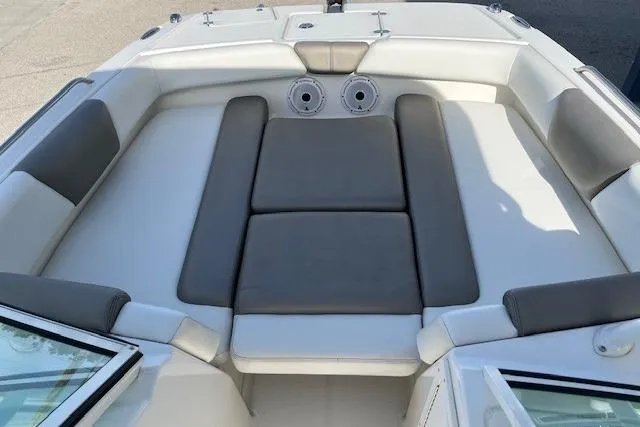 Slide: The Image of 2021 World Cat 230 SD boat interior with cushioned seating and cup holders. - 3