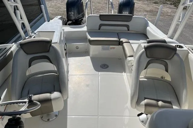 Slide: The Image of Interior view of 2021 World Cat 230 SD boat with seating and dual engines. - 5