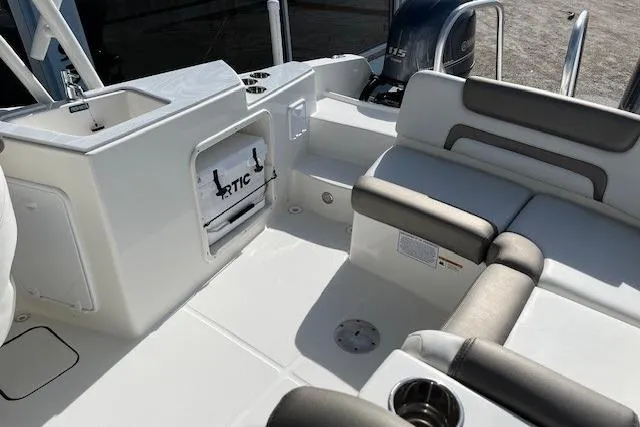 Slide: The Image of 2021 World Cat 230 SD boat interior with seating and storage compartments. - 6