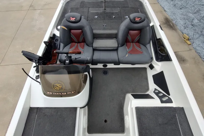 Slide: The Image of 2005 Ranger 520SVX Comanche boat interior with dual seats and steering console. - 9