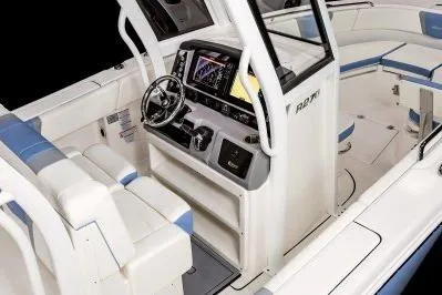 Slide: The Image of 2026 Robalo R270 Center Console boat interior with modern helm and seating. - 11