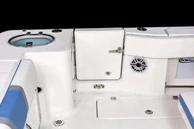 Slide: The Image of 2026 Robalo R270 Center Console boat interior with storage, speaker, and seating features. - 13