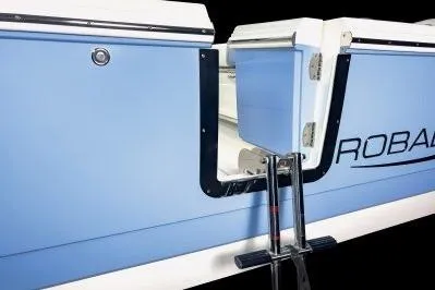 Slide: The Image of 2026 Robalo R270 Center Console boat with open side door and step ladder. - 14