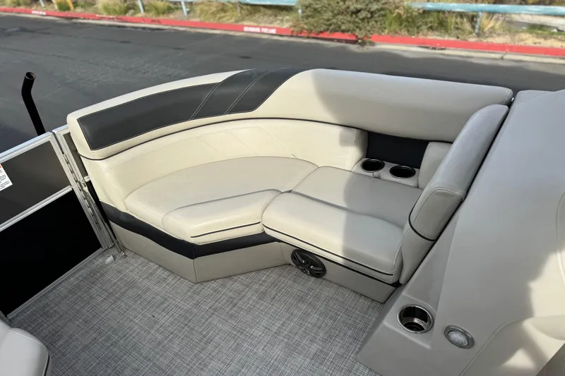 Slide: The Image of Luxurious seating on 2023 Berkshire 22RFX LE pontoon boat with cup holders and speaker. - 12