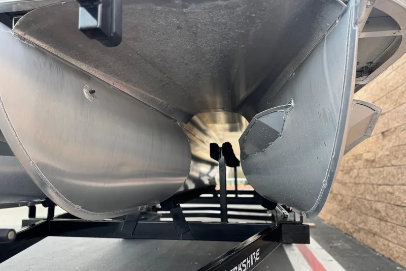 Slide: The Image of 2023 Berkshire 22RFX LE pontoon boat underside on trailer, showcasing aluminum construction. - 4