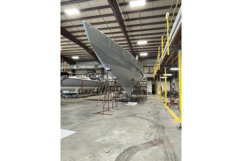 Slide: The Image of Sailboat in a warehouse, Sparkman & Stephens 12M, 1997 model, under maintenance. - 10