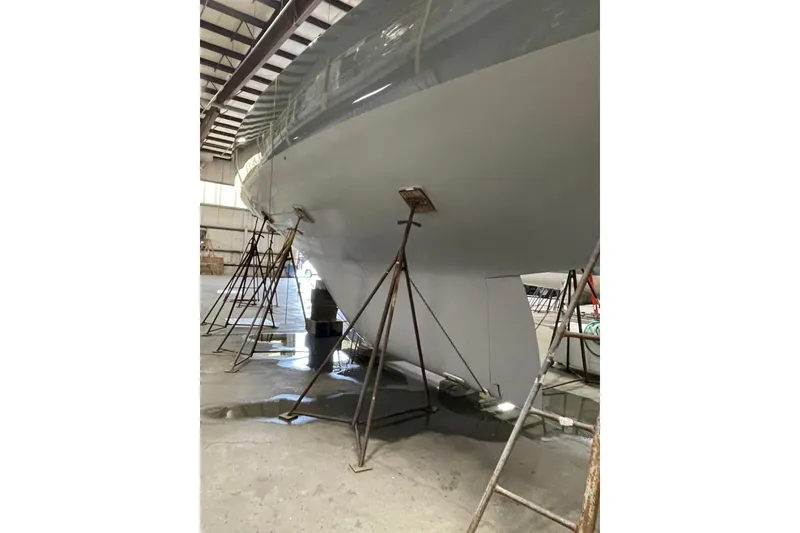 Slide: The Image of 1997 Sparkman & Stephens 12M yacht in dry dock, supported by stands. - 12