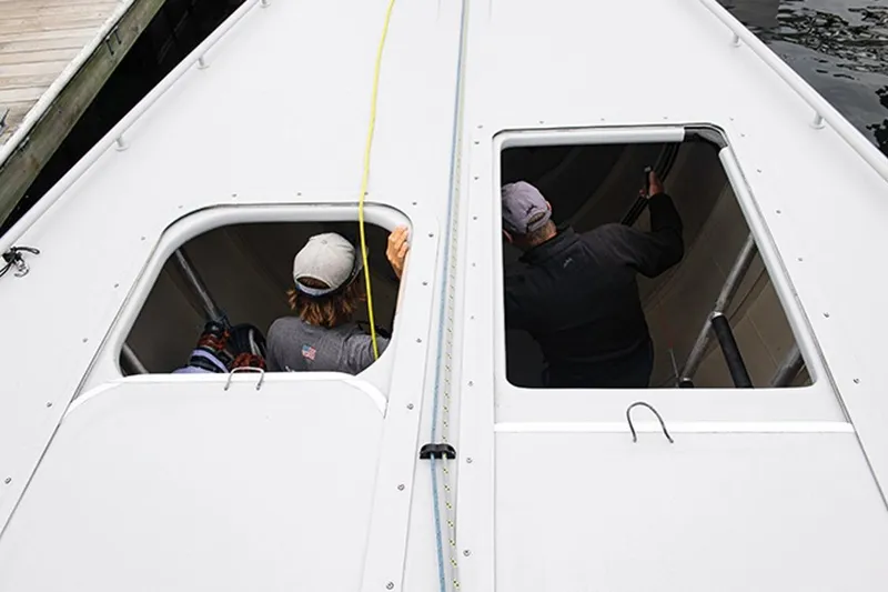 Slide: The Image of Two people inside a 1997 Sparkman & Stephens 12M yacht, viewed from above. - 16