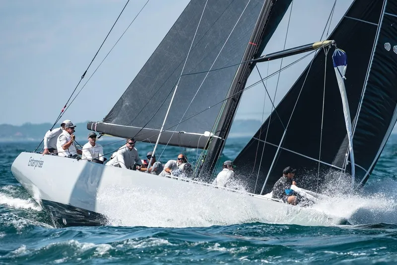 Slide: The Image of Sailing yacht Sparkman & Stephens 12M, 1997 model, cutting through waves with crew onboard. - 3