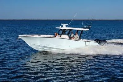The Image of 2026 Robalo R360 Center Console boat cruising on open water. - 1