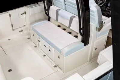 Slide: The Image of 2026 Robalo R360 Center Console boat interior with seating and storage. - 16