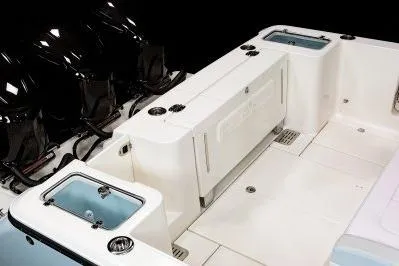 Slide: The Image of 2026 Robalo R360 Center Console boat interior with livewells and storage compartments. - 20