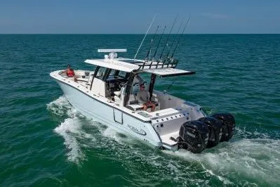 Slide: The Image of 2026 Robalo R360 Center Console boat cruising on open water. - 3