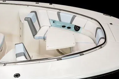 Slide: The Image of 2026 Robalo R360 Center Console boat with spacious seating and table. - 7