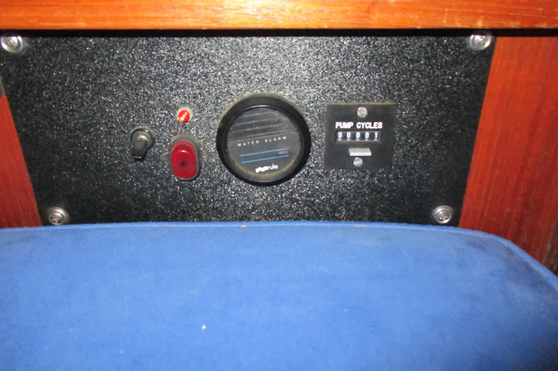Slide: The Image of Control panel of a 1977 Valiant 40 yacht with water alarm and pump cycle indicators. - 27