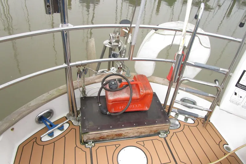 Slide: The Image of 1977 Valiant 40 sailboat deck with Honda fuel tank and safety equipment. - 8