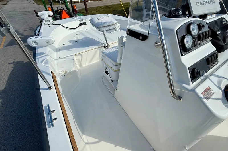 Slide: The Image of 2017 Boston Whaler 210 Montauk boat interior with Garmin navigation system and seating. - 11